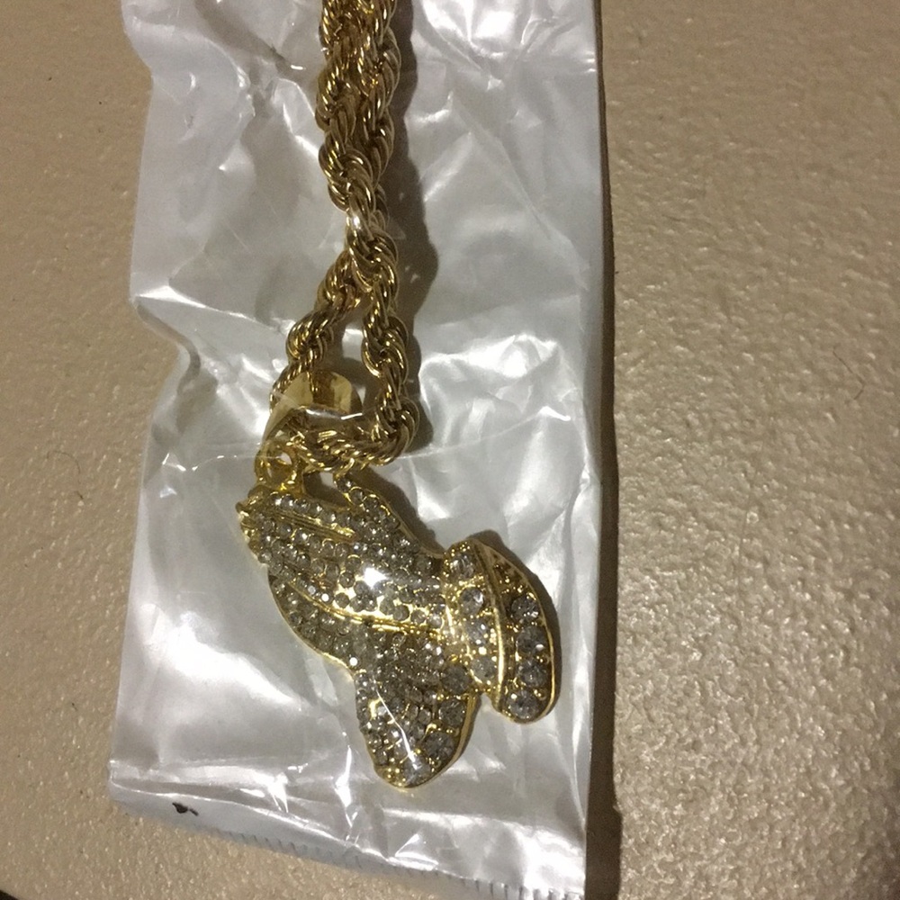 Gold chain with praying hands